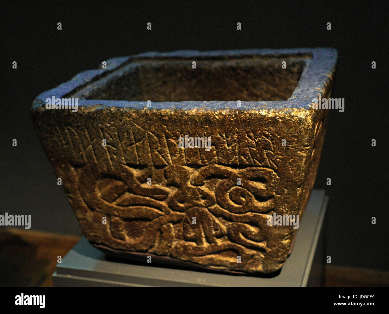 Paleo-Christian Era. Baptismal font with the inscription 'Sven made me' and a relief depicting Gunnar in the serpent's nest, the scene of the Volsunga saga. From Norum, provincial of Bohuslan. Historic museum. Stockholm. Sweden. Stock Photo