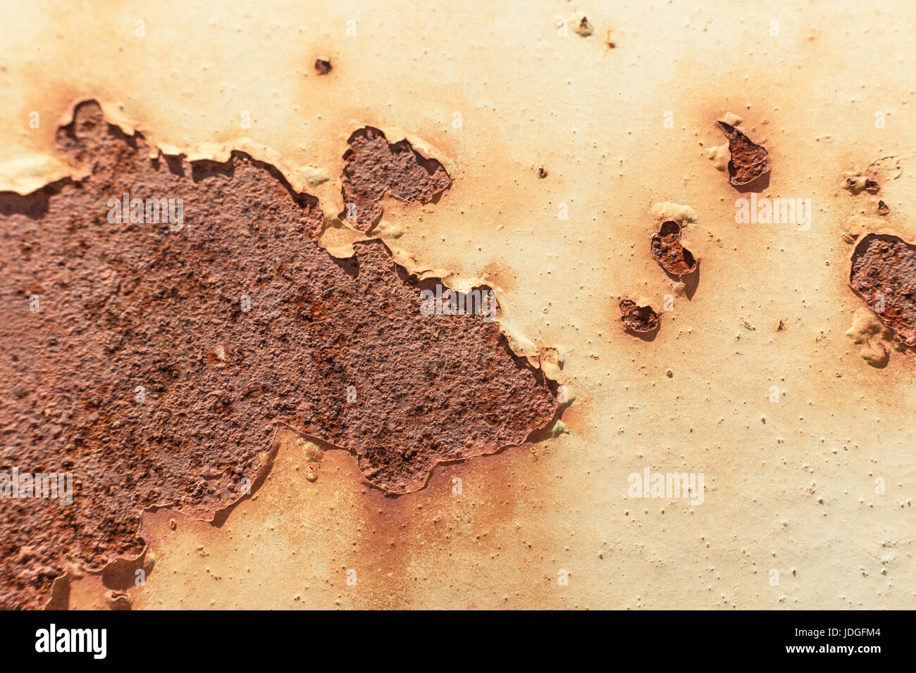 Paint flaking off rusty surface Stock Photo