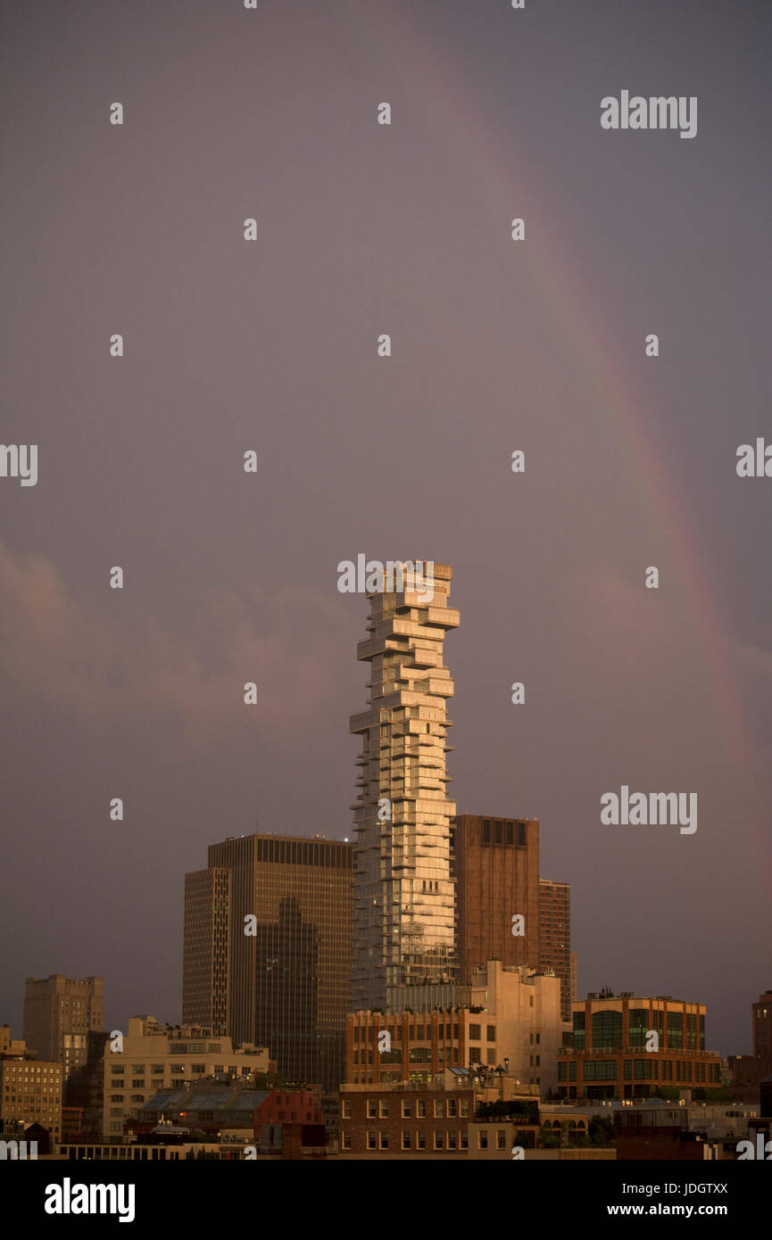 After a storm with heavy rain, lightning and high winds, the rain abated and a rainbow arced over the sky in Tribeca, Lower Manhattan. Stock Photo