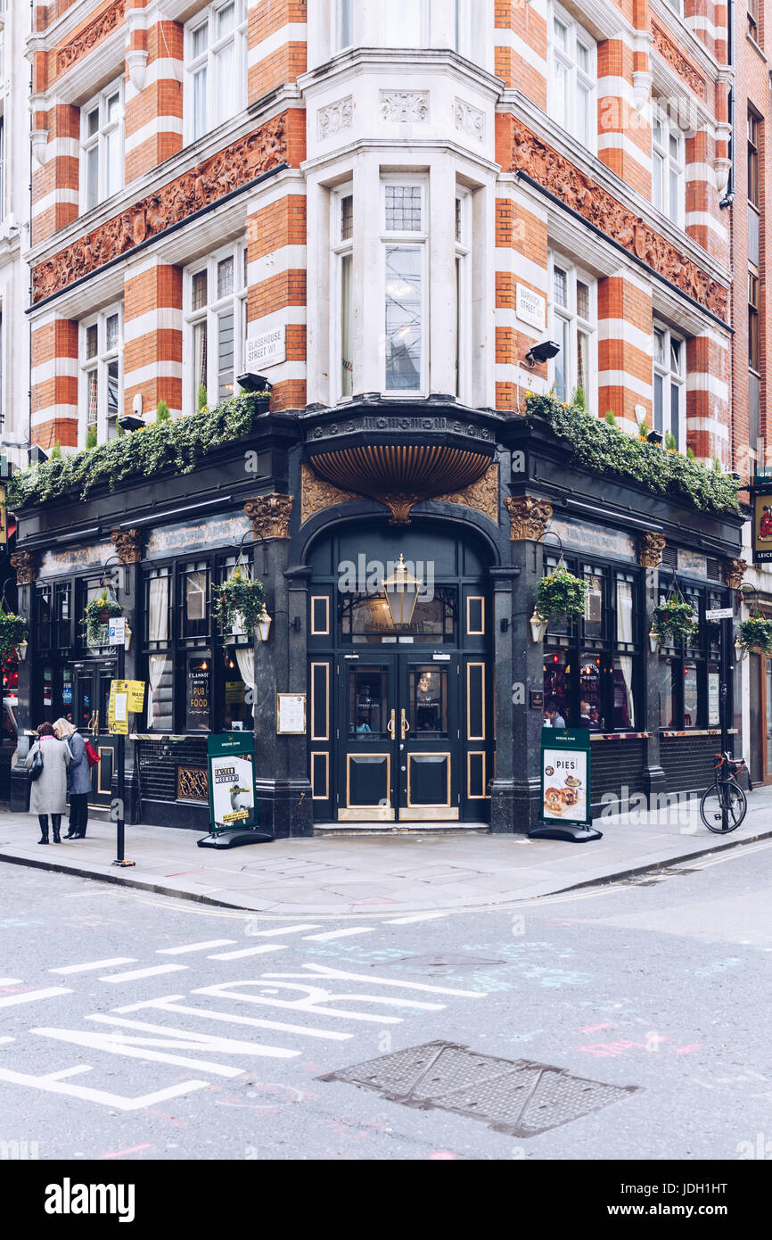 London, UK - April 1, 2017: Facade of Greene King, typical british pub