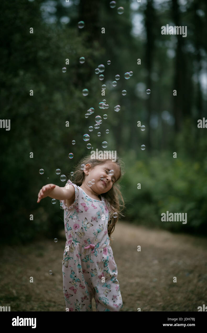 kid playing bubbles Stock Photo Alamy
