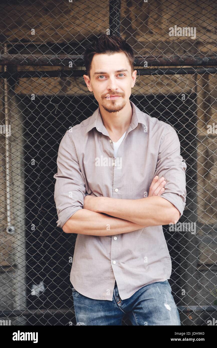 Handsome man outdoors portrait in the city. Warm colors Stock Photo - Alamy