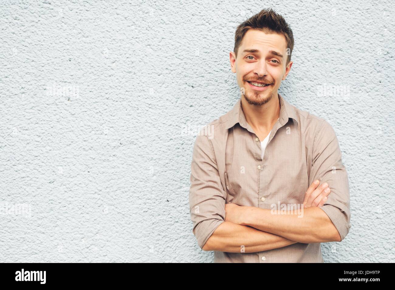 Handsome man outdoors portrait in the city. Warm colors Stock Photo - Alamy
