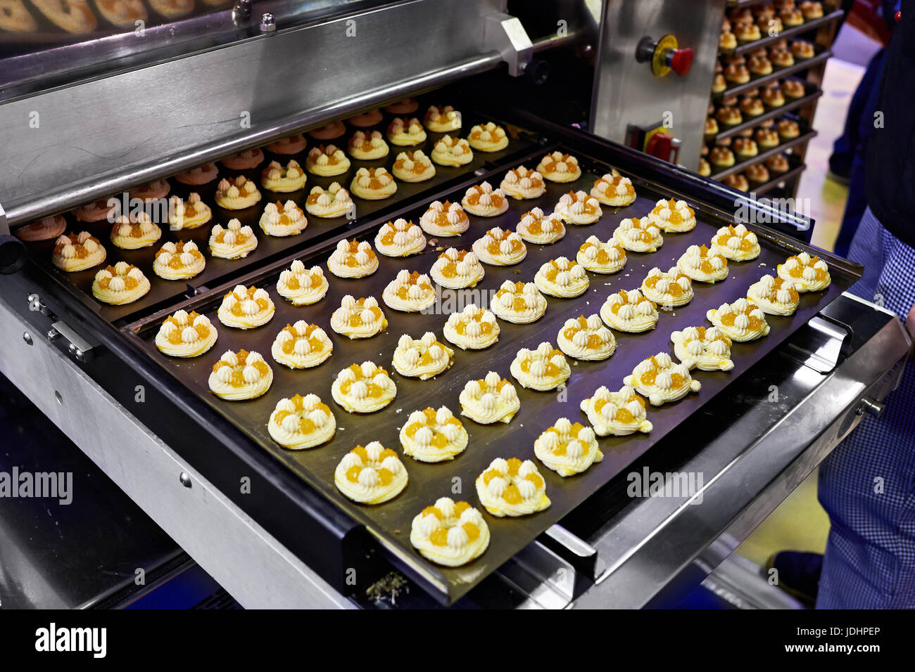 Conveyor with cakes in the factory Stock Photo