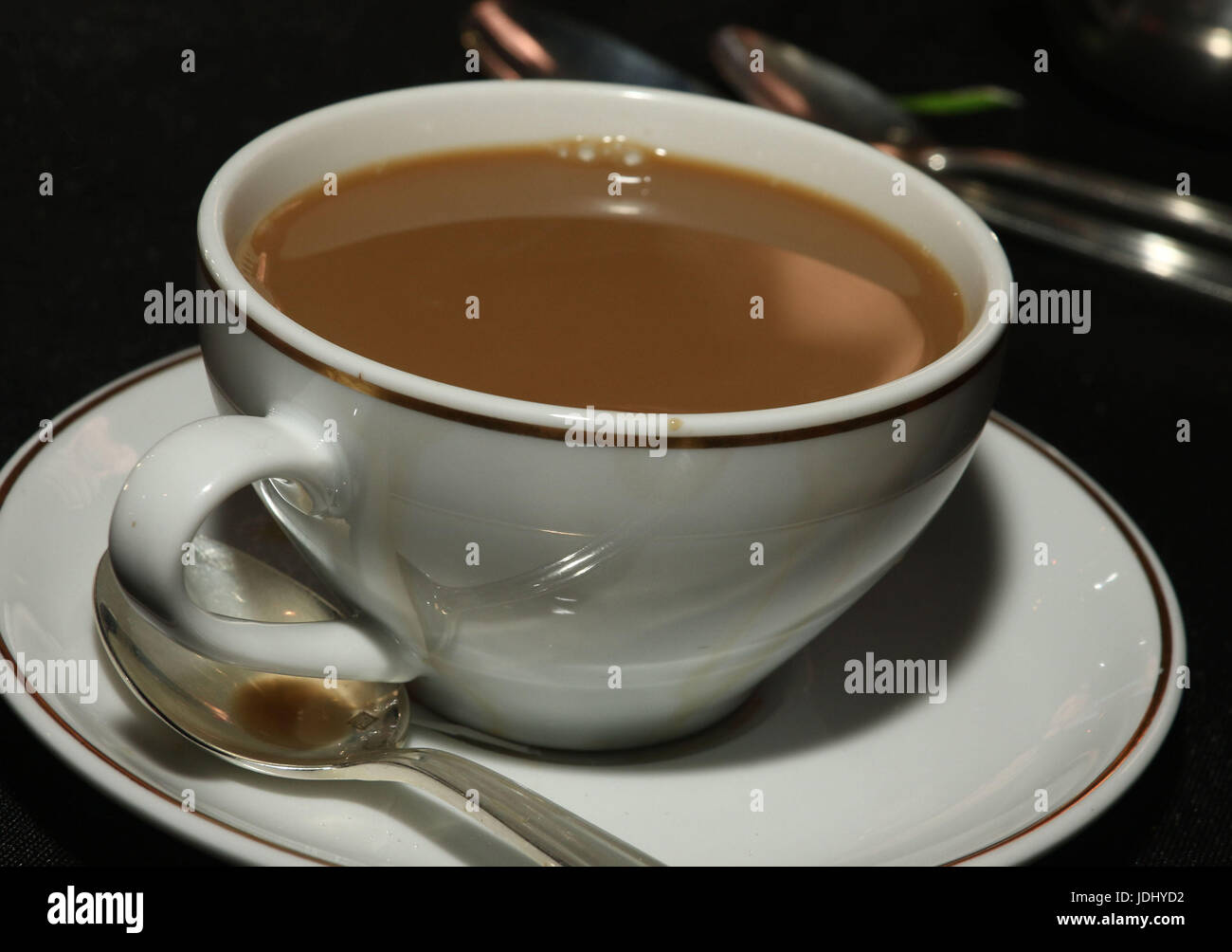 Coffee with milk in cup and saucer Stock Photo