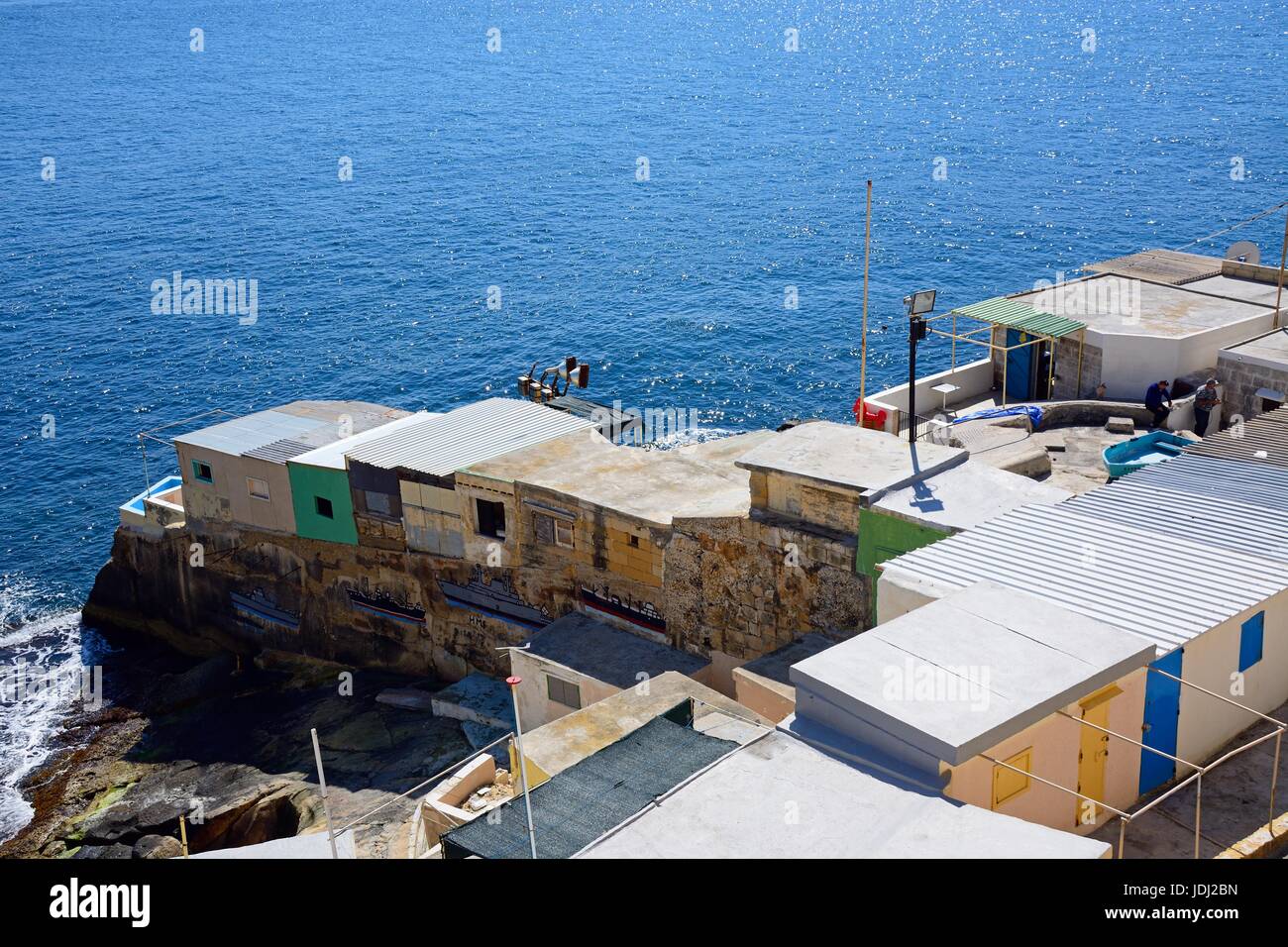 Fishermens cabins along Triq Il-Mediterran by the shoreline, Valletta, Malta, Europe. Stock Photo