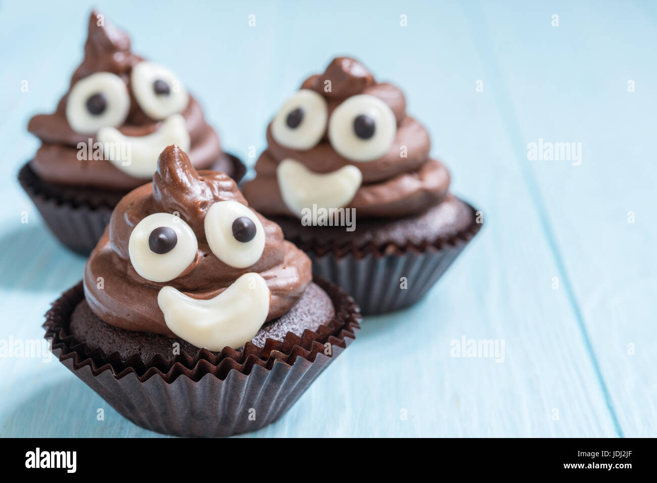 poop emoji cupcakes Stock Photo - Alamy