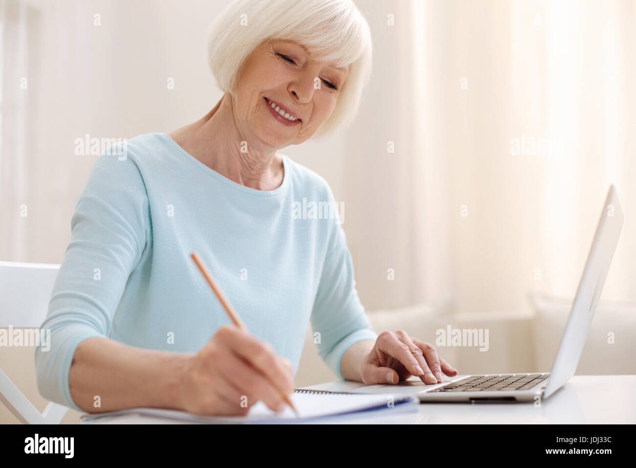 Inspired productive woman working from home Stock Photo