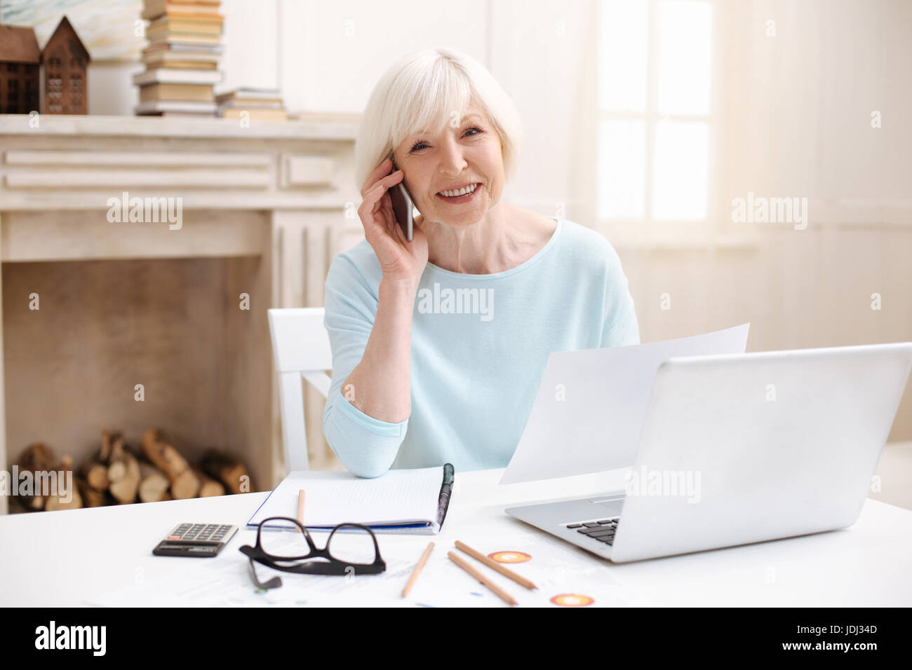 Ambitious elderly lady managing the project from home Stock Photo