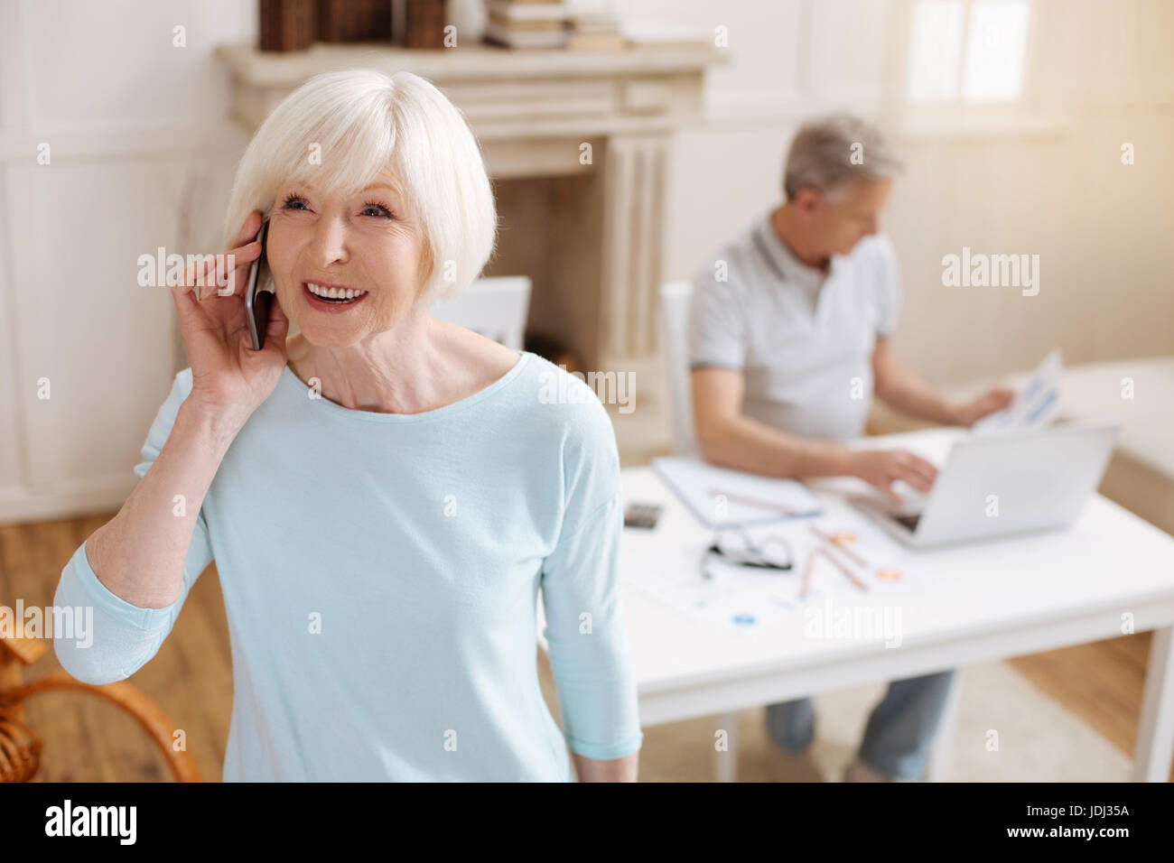 Charismatic ambitious lady making a phone call Stock Photo