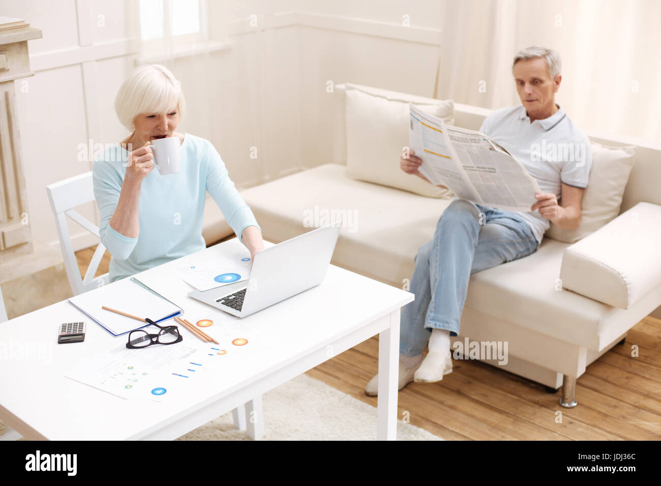 Inspiring elderly couple being active at home Stock Photo