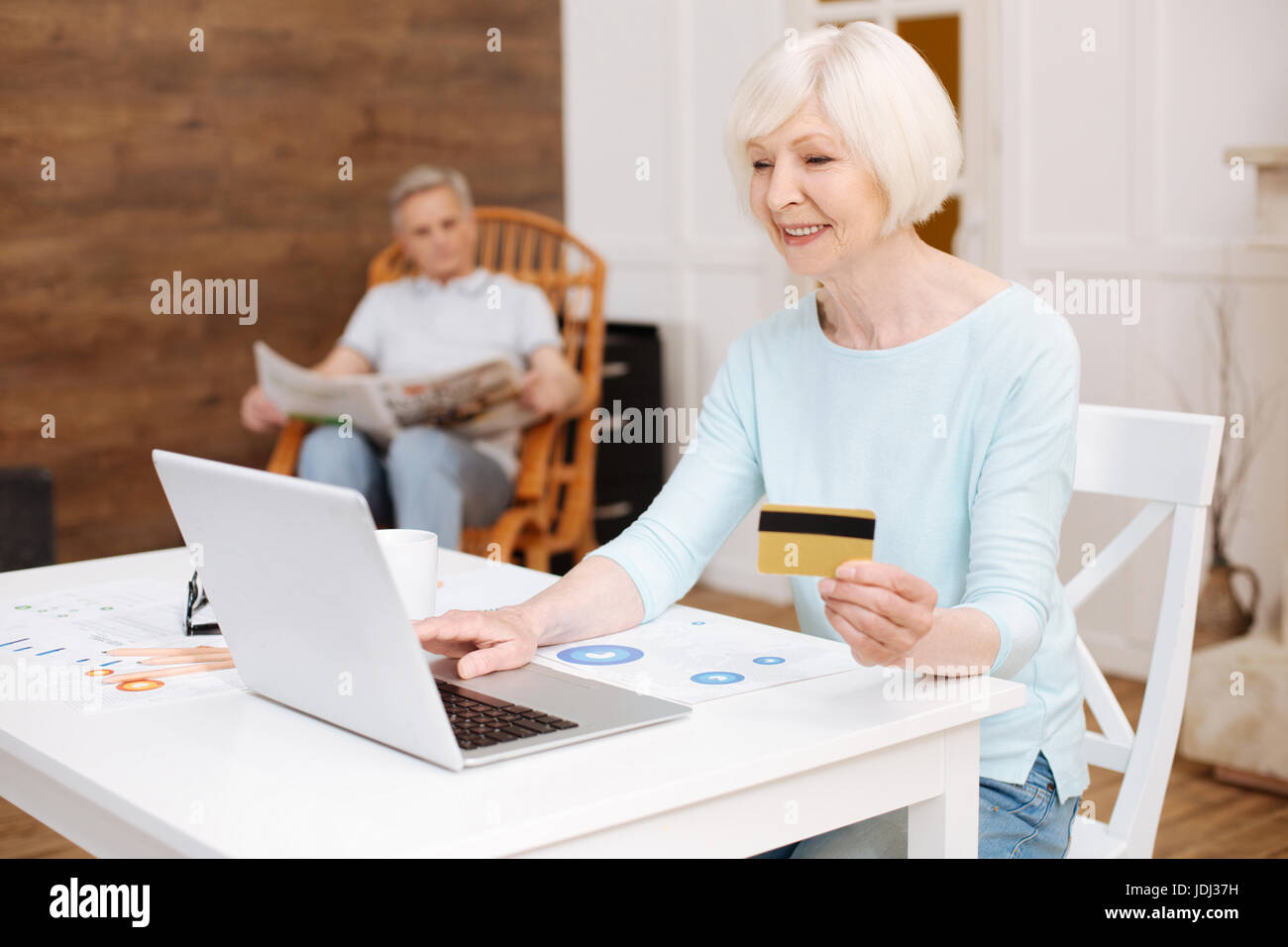 Lovely enthusiastic lady shopping online Stock Photo