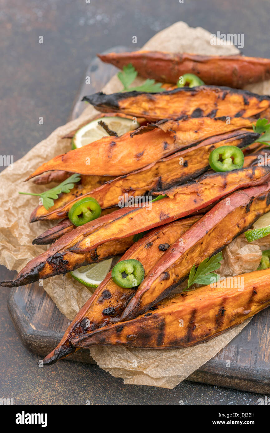 Roasted sweet potatoes on the grill Stock Photo Alamy