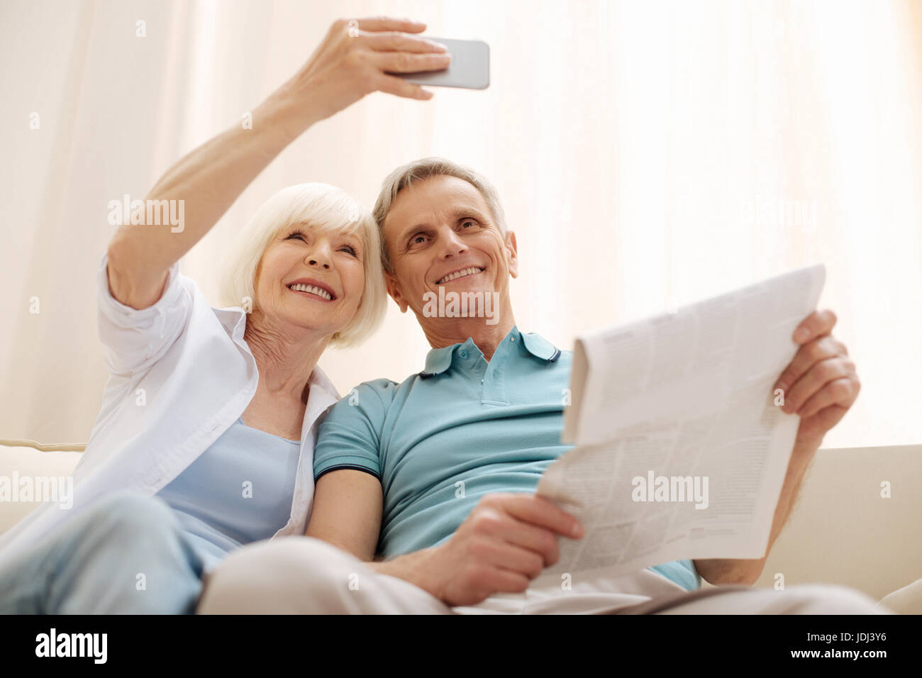 Sweet romantic elderly couple taking a selfie Stock Photo