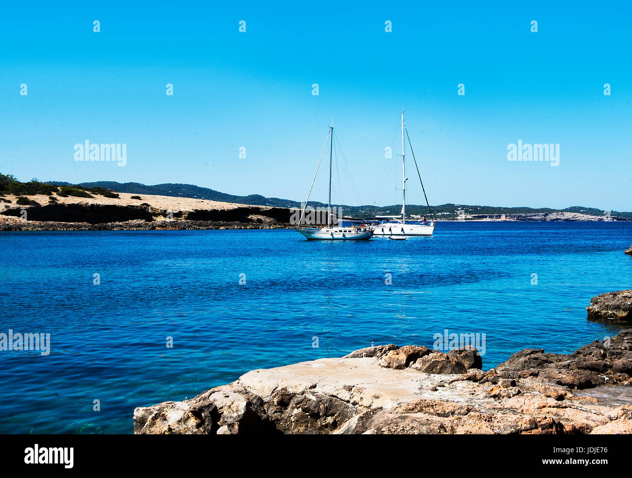 Yachts in small cove Cala Gracio Ibiza Stock Photo
