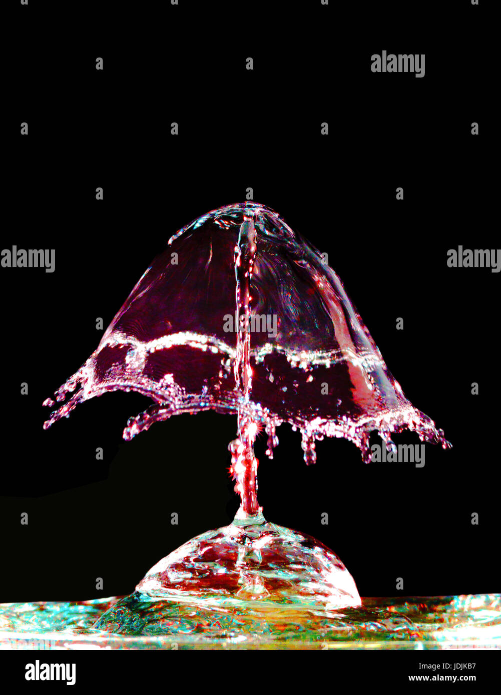 Colorful liquid splash on black background closeup Stock Photo - Alamy