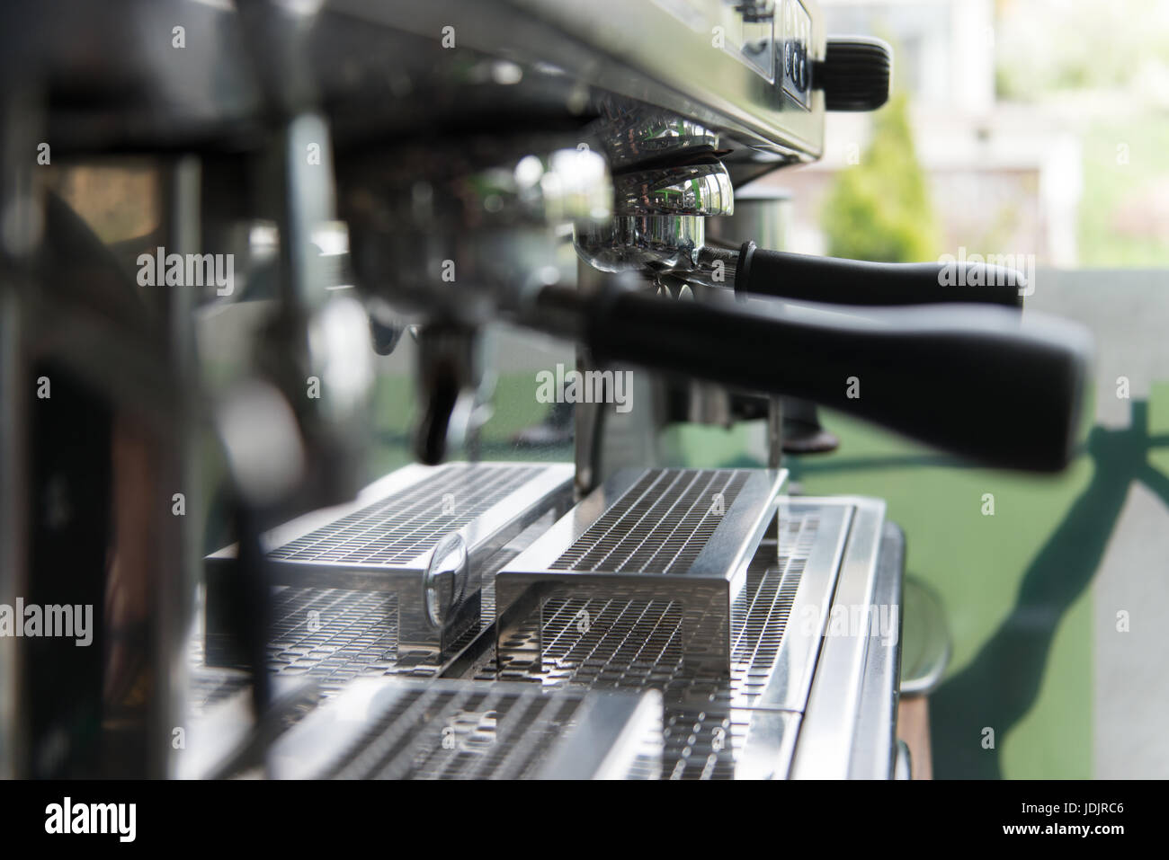 Close-up of Professional Coffee Machine Making Espresso in a Cafe Stock Photo