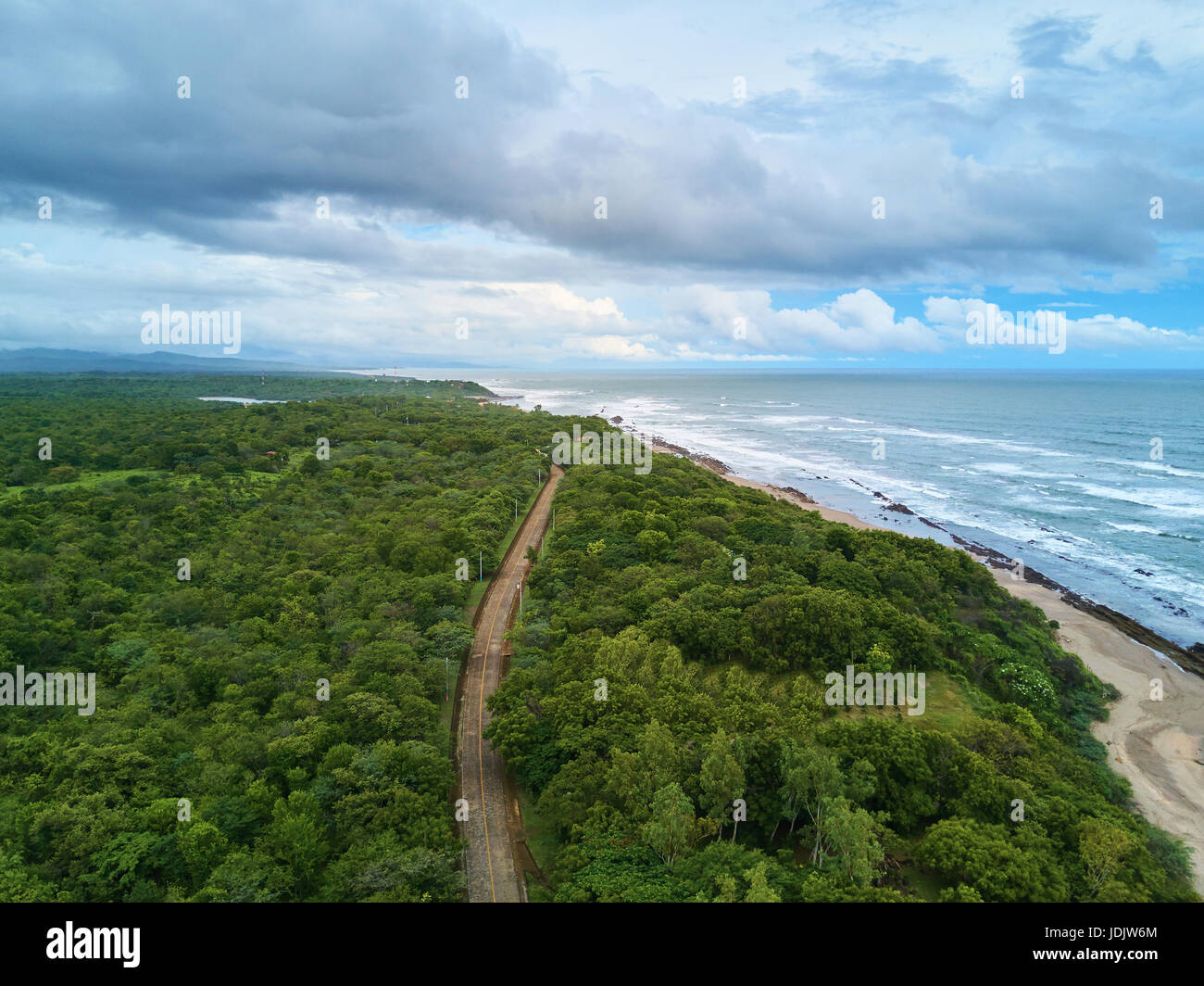 Rainy season in Pacific coast aerial view. Ocean shore with big waves Stock Photo