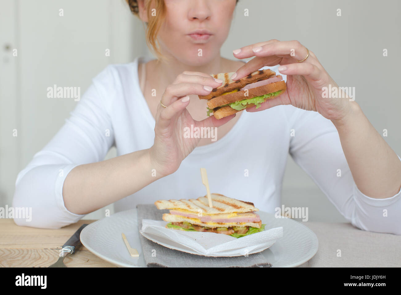 Unrecognizable woman having sandwich Stock Photo