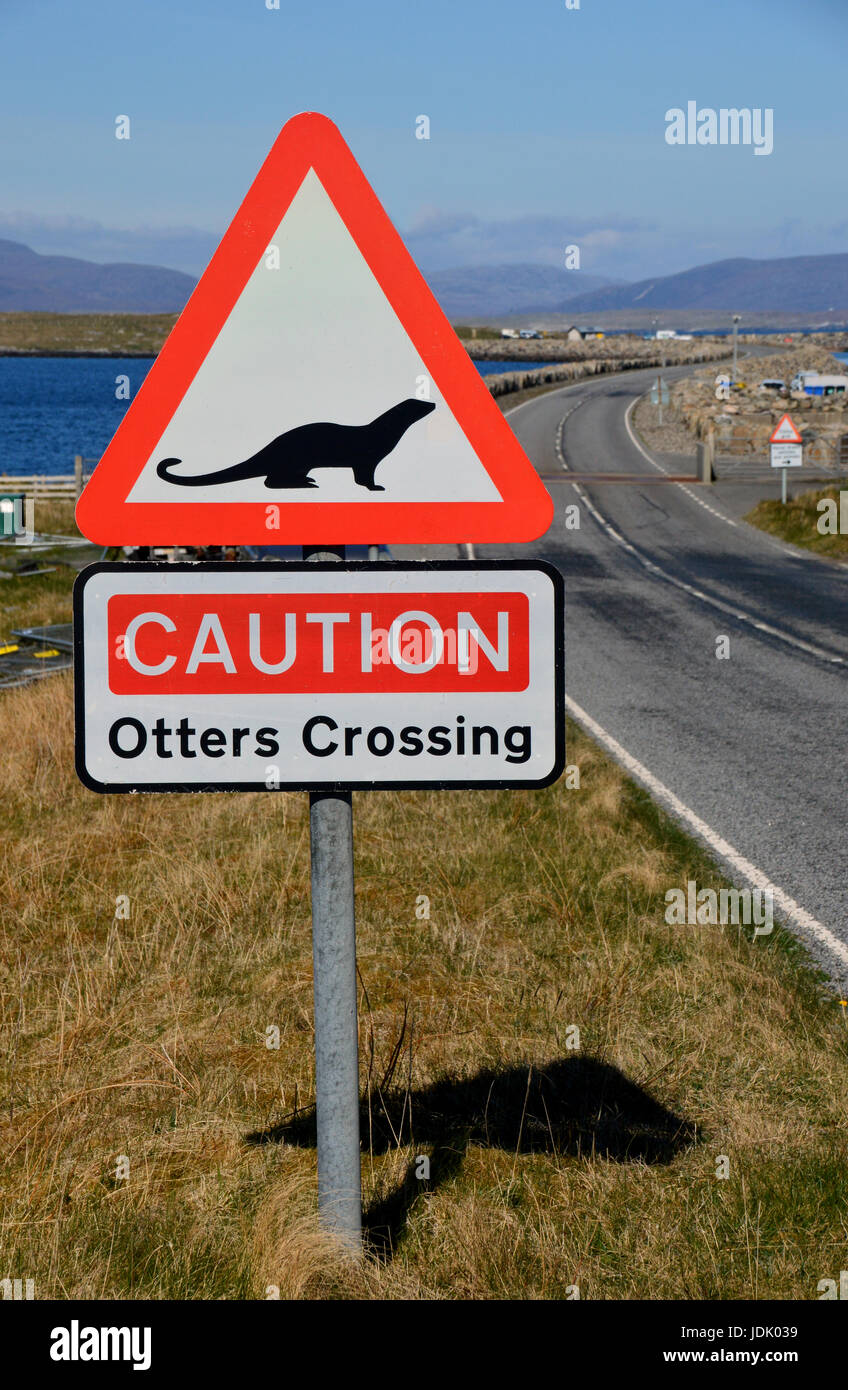 Otters Crossing Warning Sign on the Causeway Between the Islands of Berneray (Bearnaraigh) and  North Uist in the Outer Hebrides,Scottish Islands. UK Stock Photo