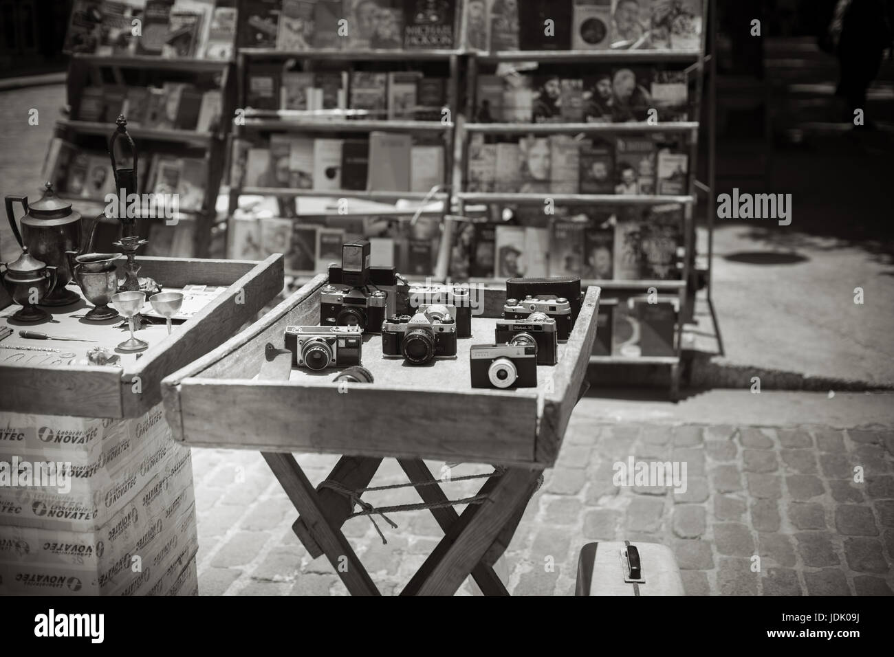 Old cameras on wooden table for sale in bw. Stock Photo