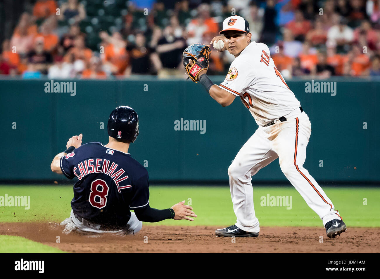 Baltimore, Maryland, USA. 20th June, 2017. Baltimore Orioles shortstop Ruben Tejada (17) gets Cleveland Indians right fielder Lonnie Chisenhall (8) out at second during MLB game between Cleveland Indians and Baltimore Orioles at Oriole Park at Camden Yards in Baltimore, Maryland. Scott Taetsch/CSM/Alamy Live News Stock Photo