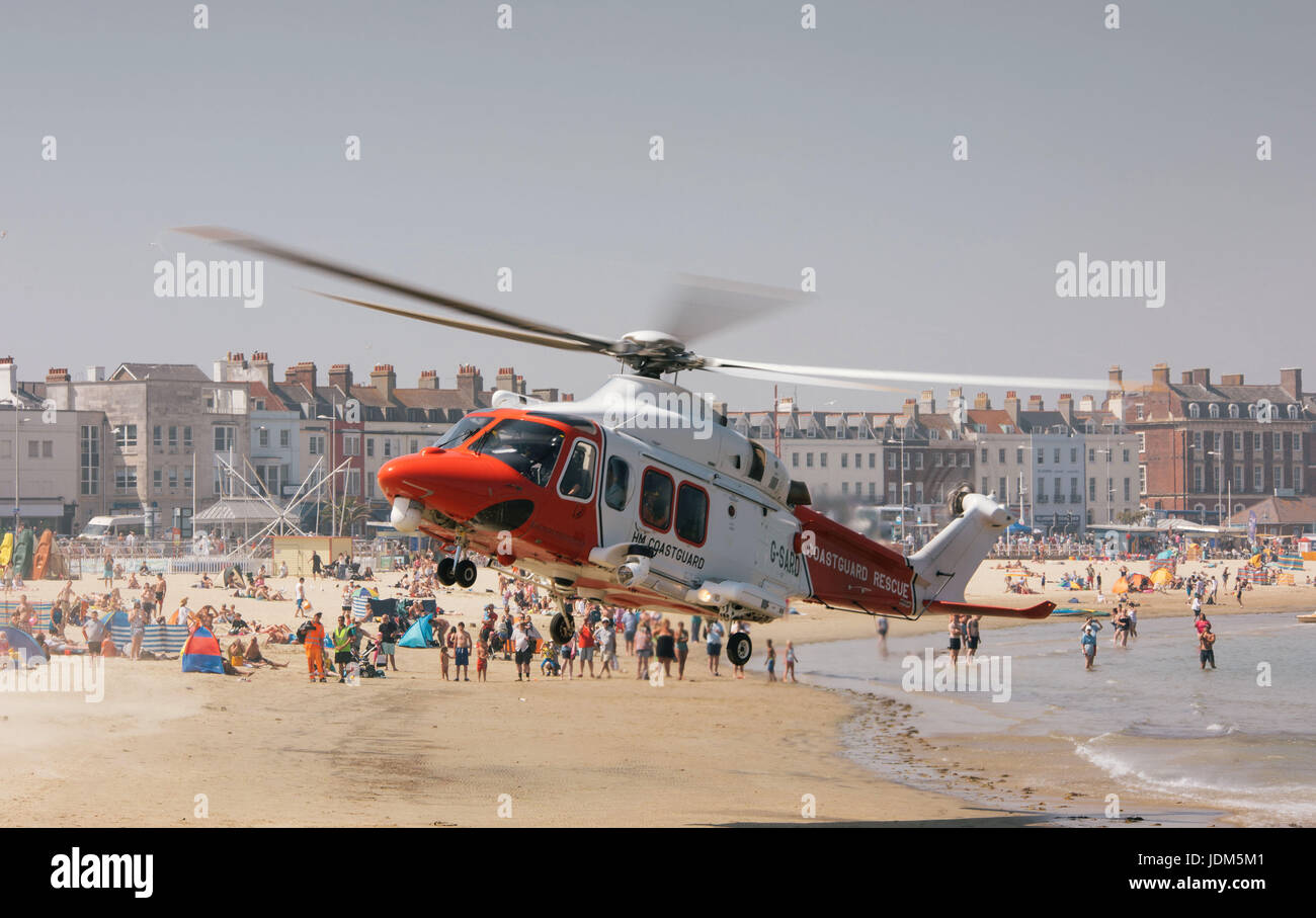 Weymouth, Dorest, UK. 21st Jun, 2017. Coastguard helicopter lands on Weymouth Beach after person collapses, Dorset UK, Picture: Justin Glynn/Alamy Live News Stock Photo