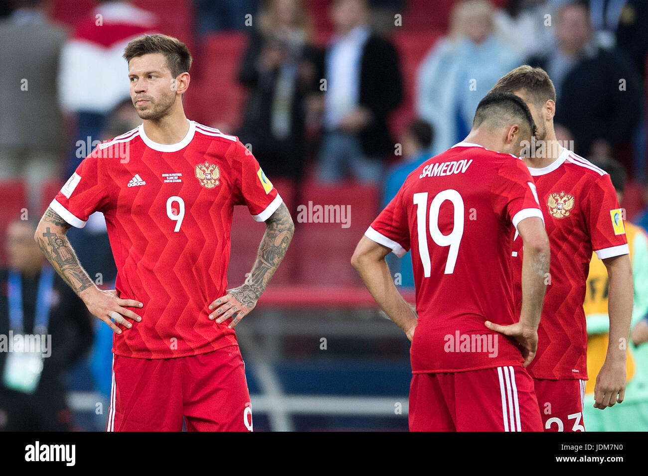 Moscow, Russia. 21st June, 2017. Russia's Fedor Smolov (left to right), Alexander Samedov and Dmitry Kombarov standing on the pitch after the preliminary stage group A match between Russia and Portugal in the Spartak Stadium in Moscow, Russia, 21 June 2017. Photo: Marius Becker/dpa/Alamy Live News Stock Photo