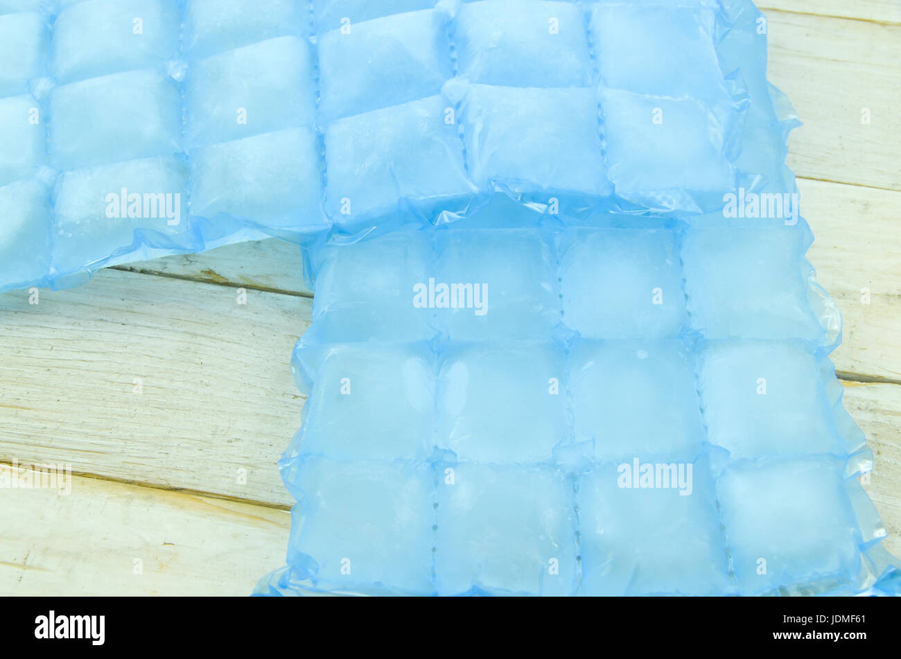 Home ice made in cube bags on wooden background Stock Photo Alamy