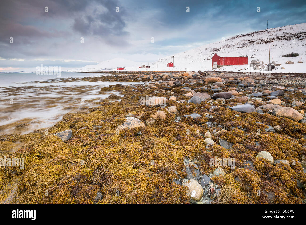 Typical norwegian warm and cozy house located at the lakeside at a