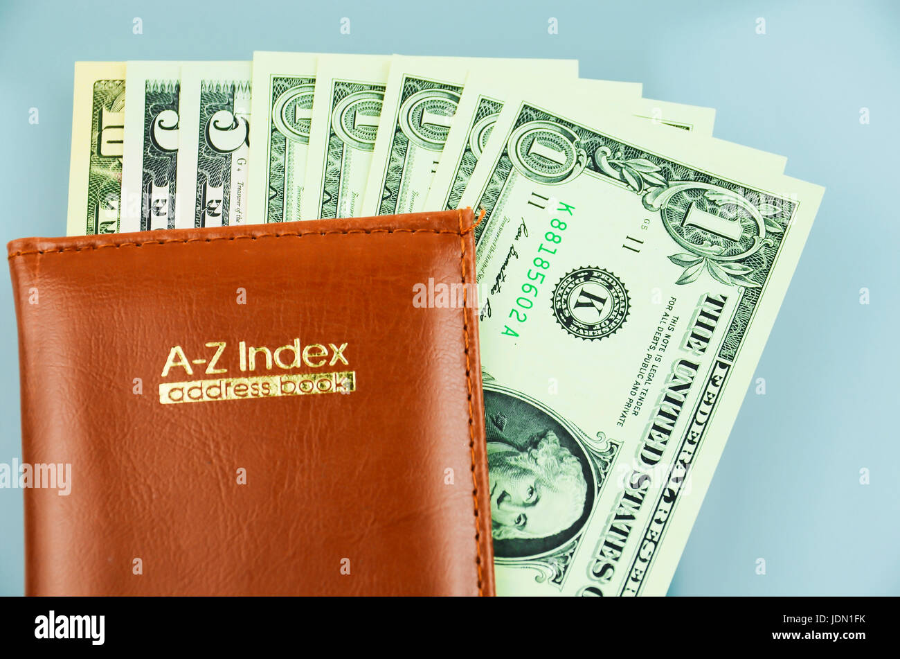 Address book with US dollars inside Stock Photo Alamy