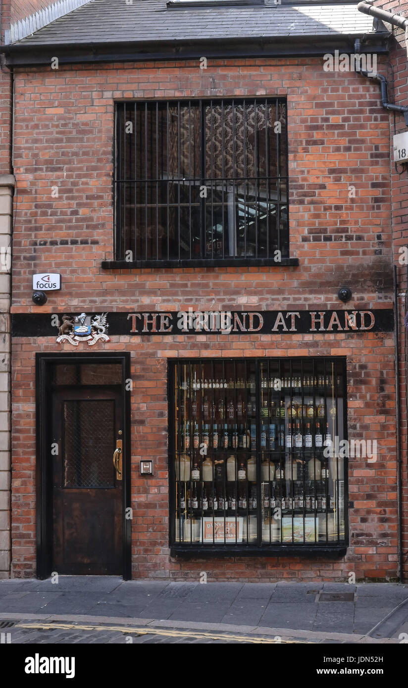 The Friend at Hand, a shop selling whiskey, Hill Street, Belfast, Northern Ireland. Stock Photo