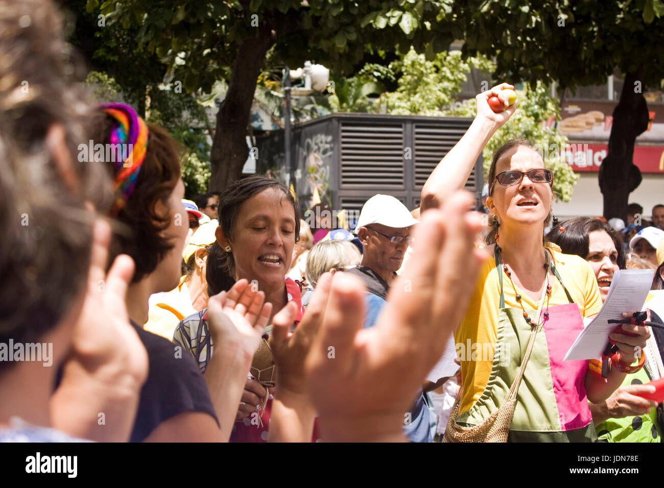 People singing during a protest against the government of Nicolas Maduro in Caracas. Stock Photo