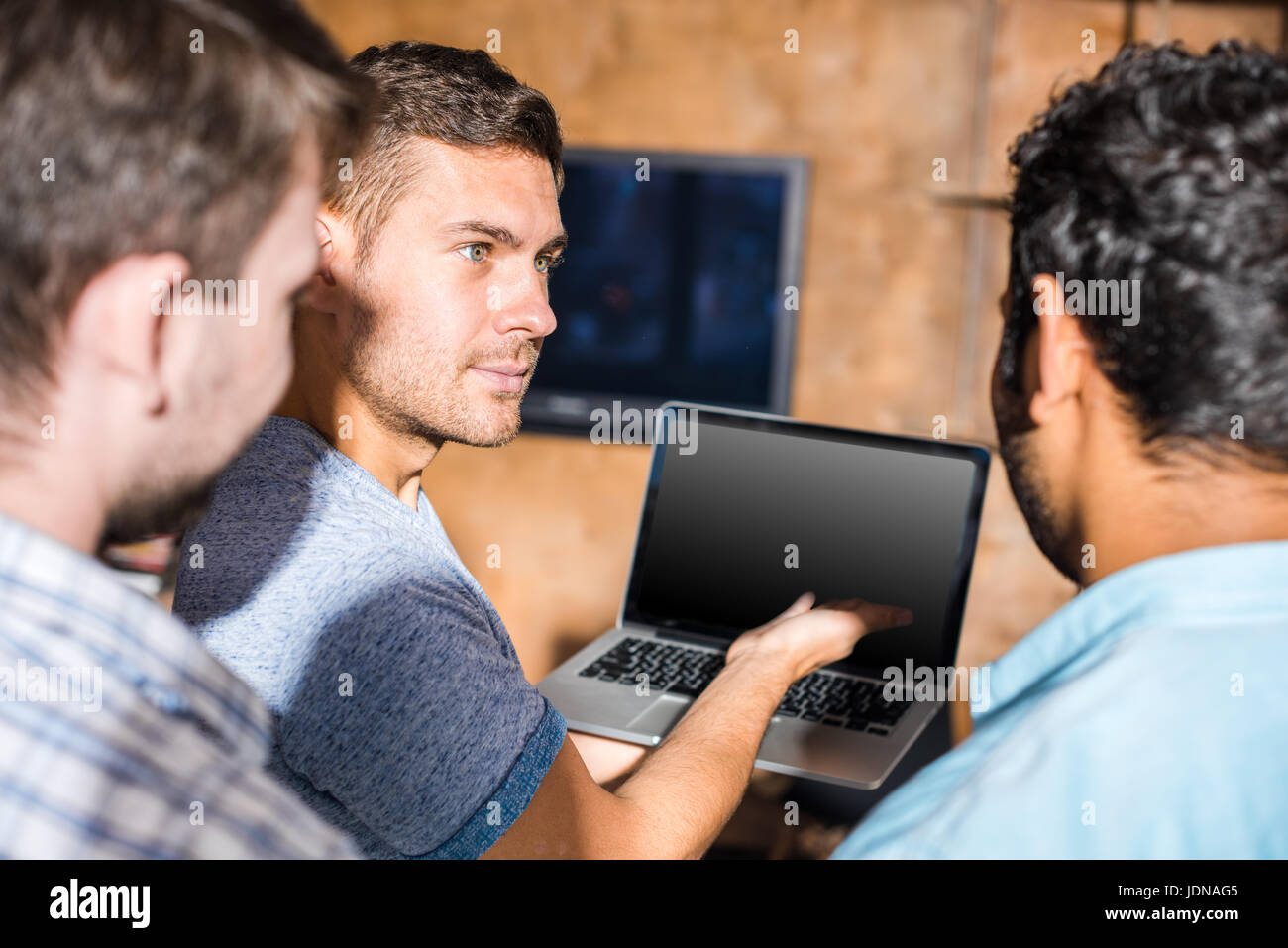 young professionals working on new business project with laptop in small business office Stock Photo