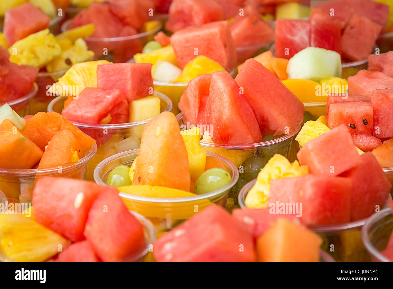 https://c8.alamy.com/comp/JDNNA4/a-variety-of-freshly-chopped-fruits-for-sale-in-cartons-at-the-cheshire-JDNNA4.jpg