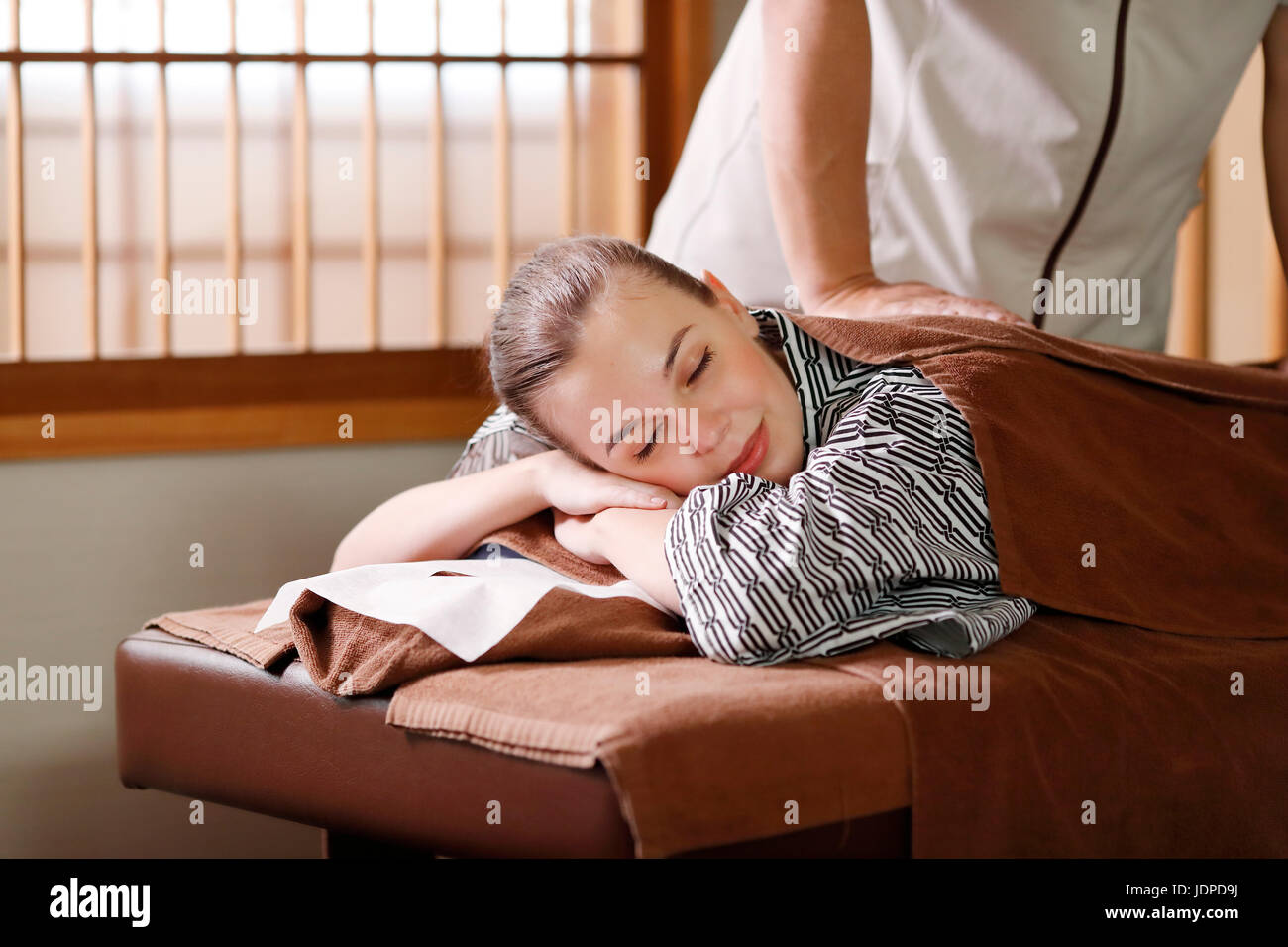 Caucasian woman getting a massage at a spa in Tokyo, Japan Stock Photo -  Alamy