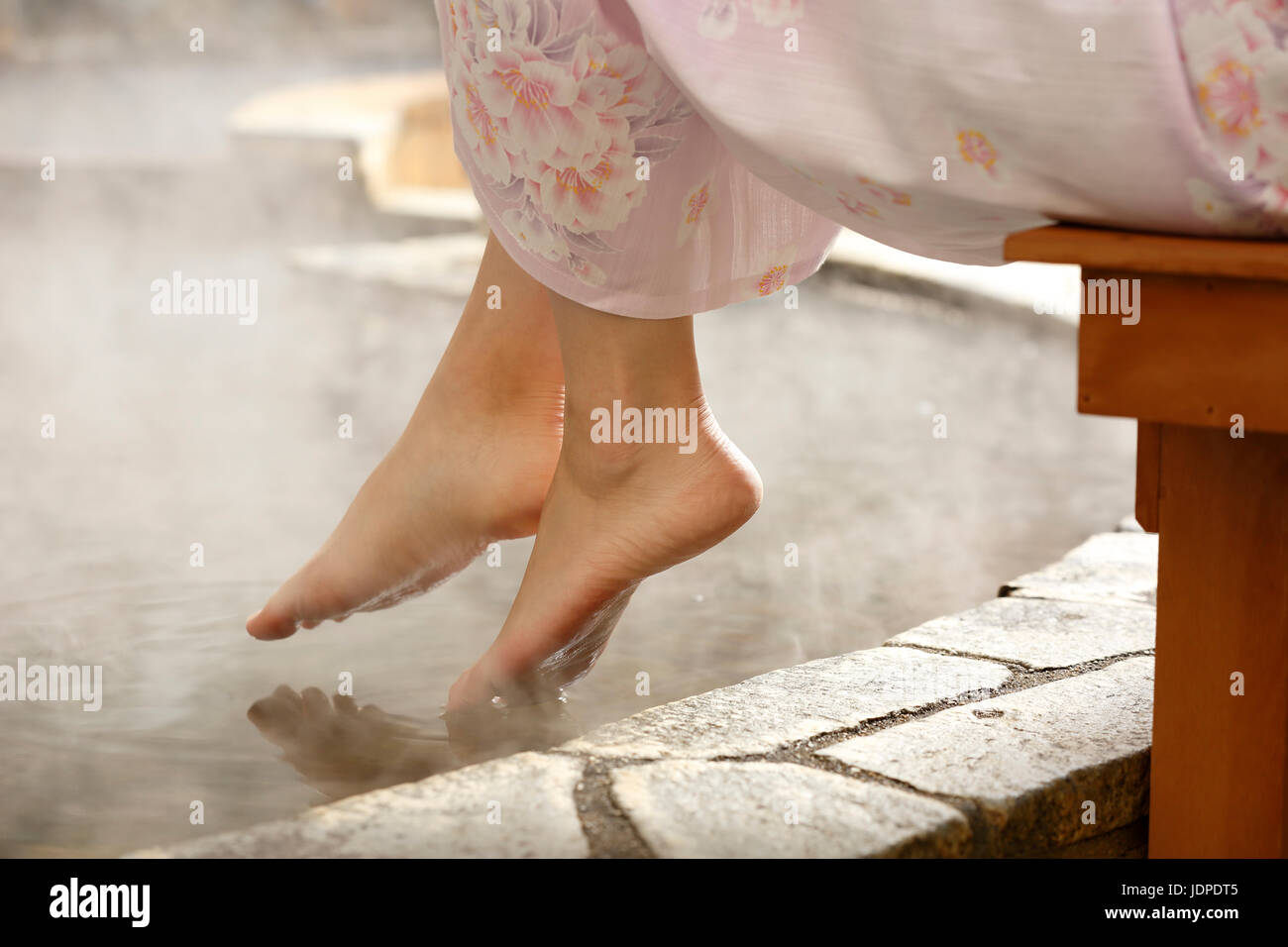 Japanese woman bathing at traditional hot spring, Tokyo, Japan Stock