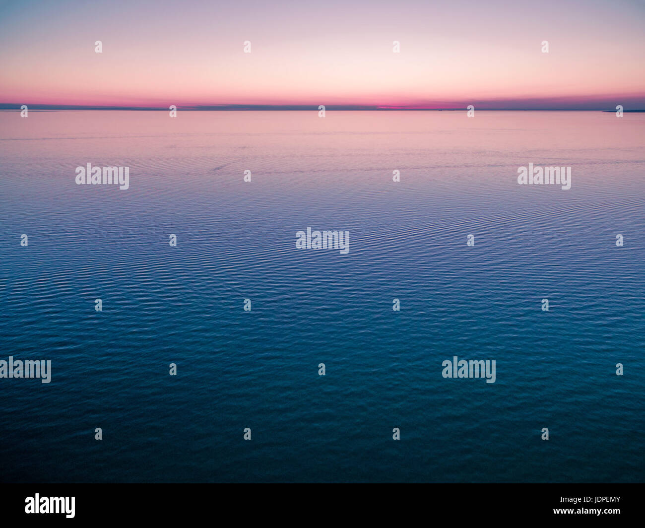 Empty horizon over water at dusk. nothing but water and clear sky. Stock Photo