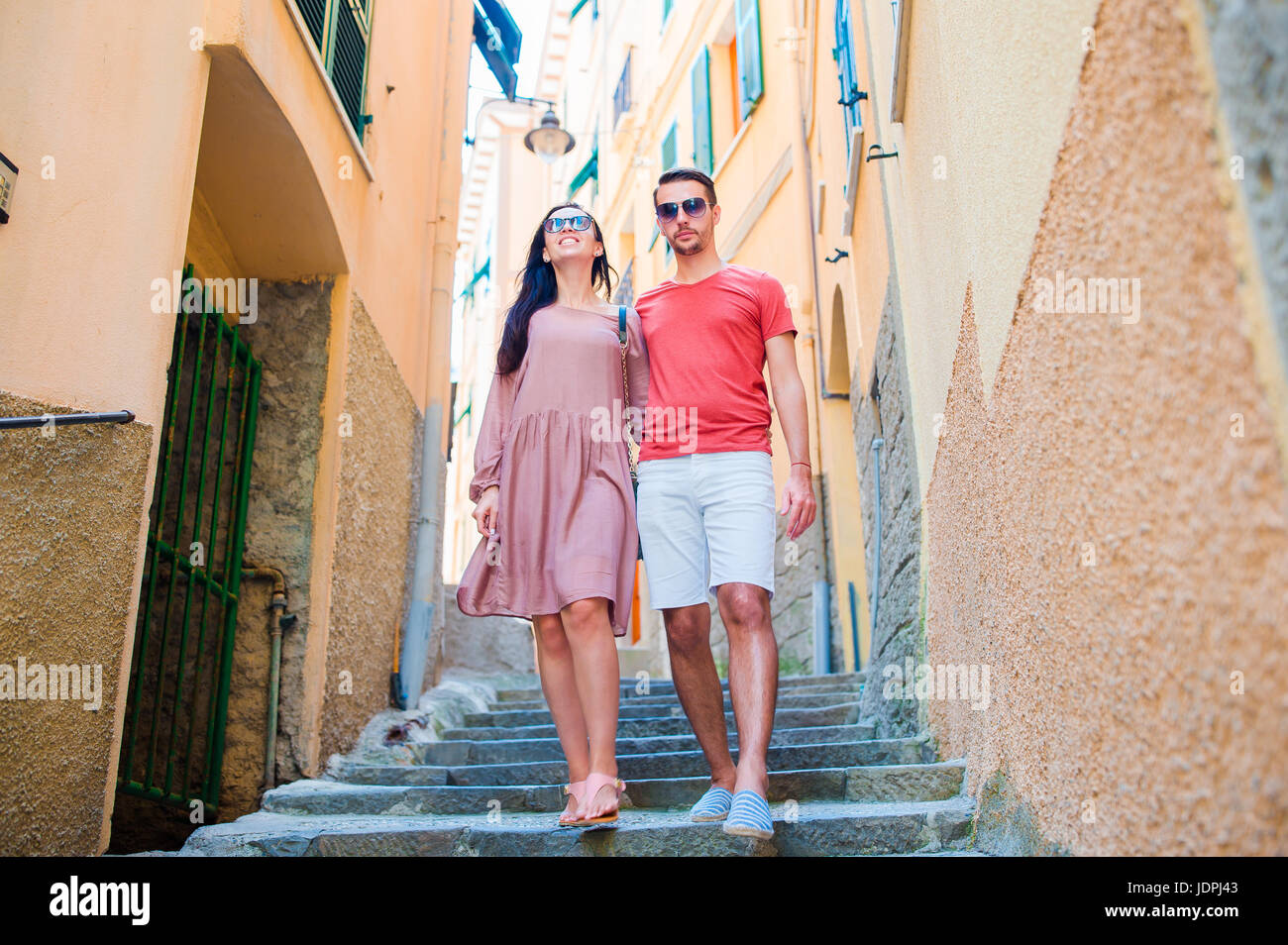 Young tourist couple traveling on holidays outdoors in italian vacation. Stock Photo