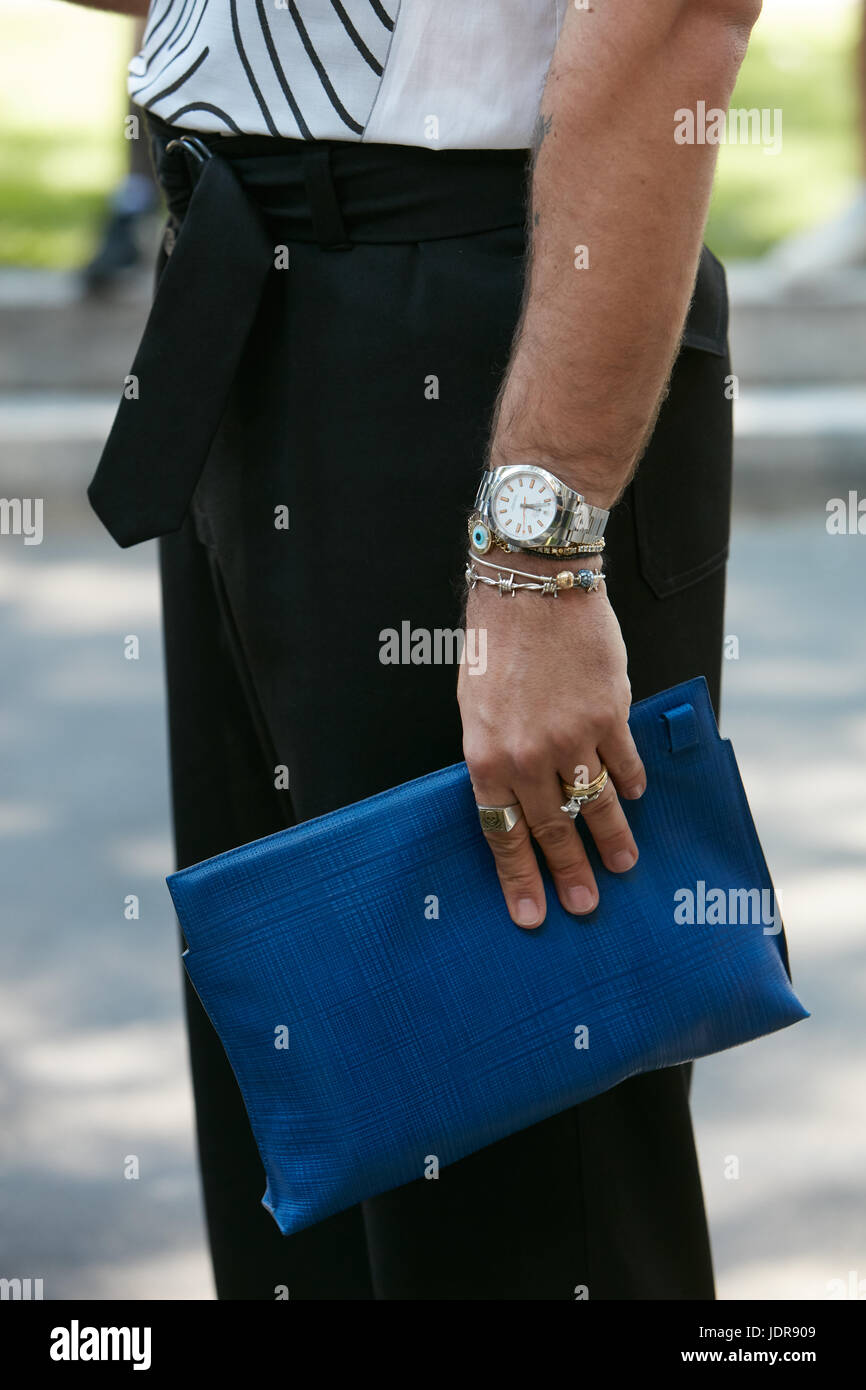 MILAN - JUNE 19: Man wrist with Rolex Milgauss watch, bracelets and blue  leather bag before Giorgio Armani fashion show, Milan Fashion Week street  sty Stock Photo - Alamy