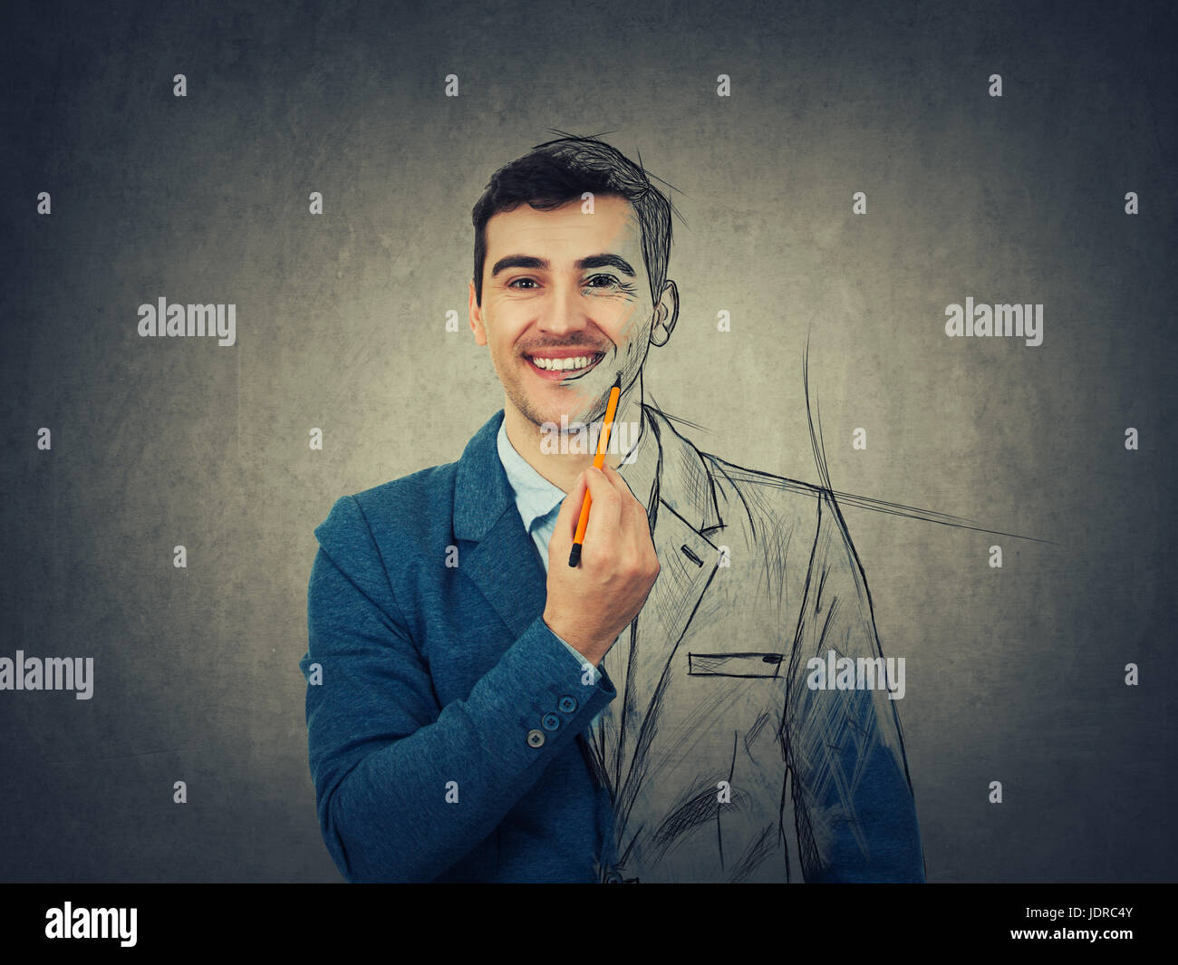 Businessman smiling and holding a pencil pointed to his face trying to ...