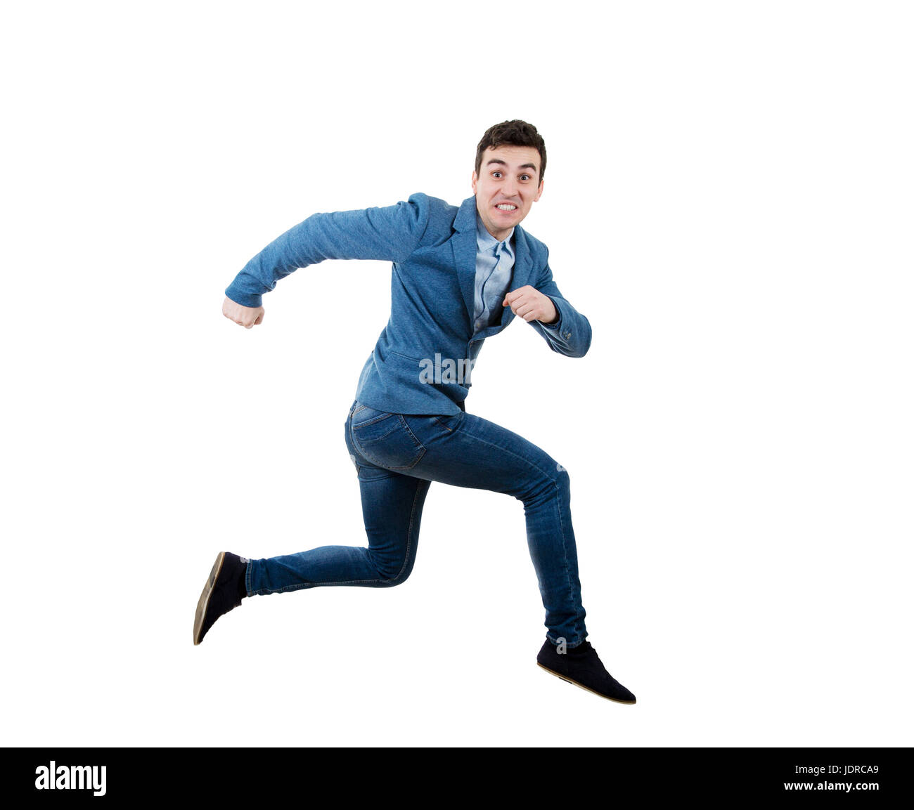 Businessman running and jumping over obstacle with a fearful expression