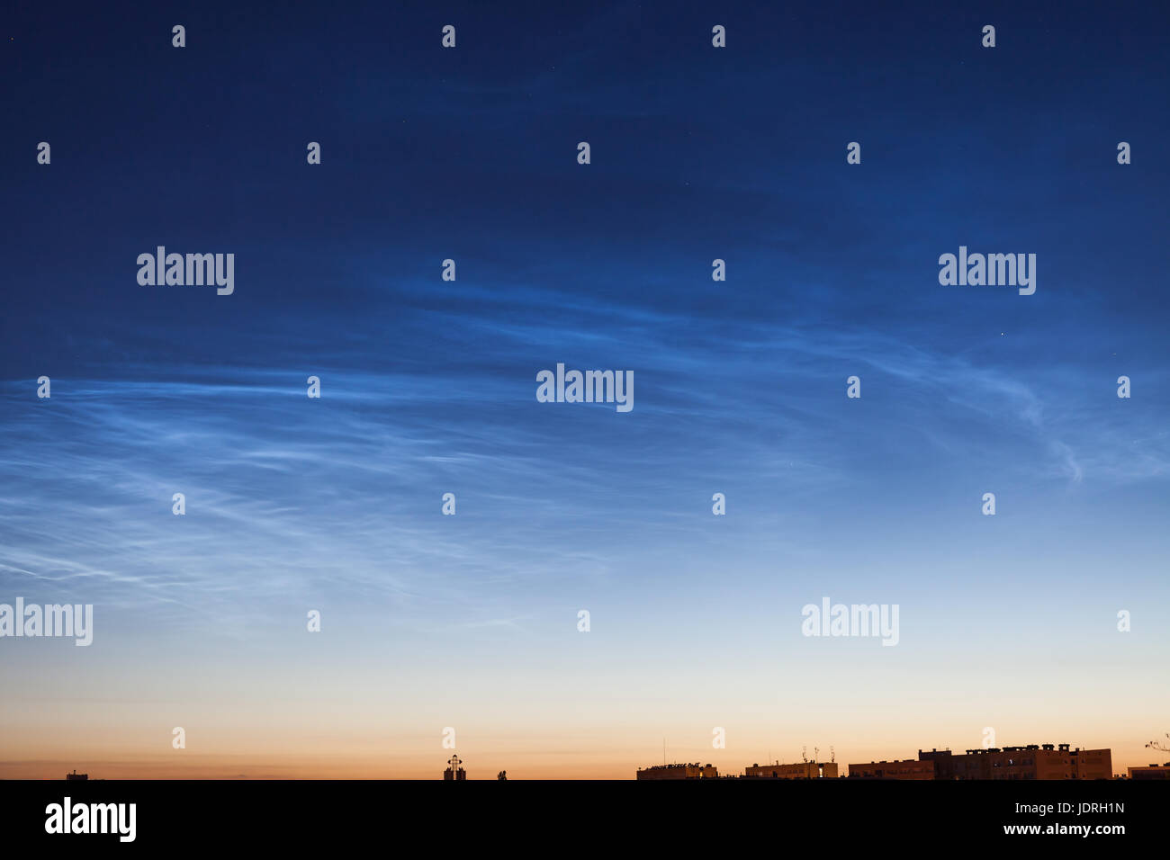 Noctilucent cloud (NLC, night clouds), cloud-like phenomena in mesosphere. They are highest clouds in Earth's atmosphere, at altitudes 76-85km. Night  Stock Photo
