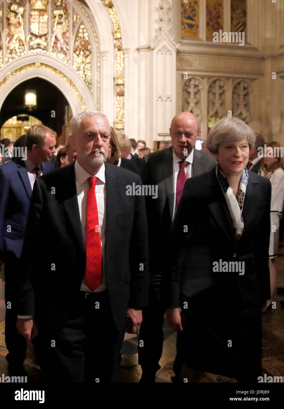 Prime Minister Theresa May and Labour leader Jeremy Corbyn walk through