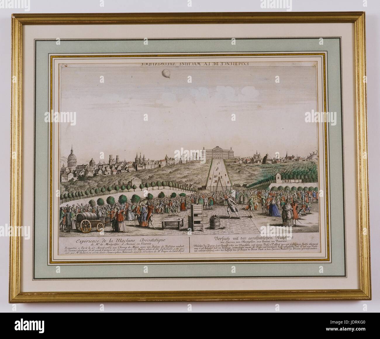 Aerostatic experiment of the Montgolfier brothers in Annonay, Vivarais   Repeated in Paris on 27th August 1783 in the Champ de Mars  Coloured etching with frame (43 x 53 cm)  Muller-Quênot Collection The experiment involved a taffeta balloon coated with elastic rubber 36ft and 6in in circumference. The flight of this balloon, filled with ignitable air, was carried out by Robert after being granted national funding following its approval by Mr Faujas de Saint Fond. Stock Photo