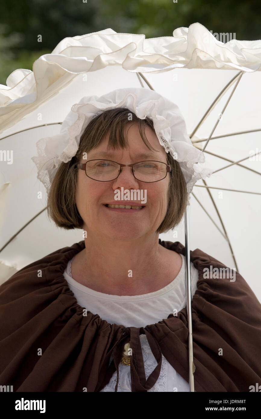 'Arabella Burlace' in period costume with parasol at Buckler's Hard village museum Stock Photo