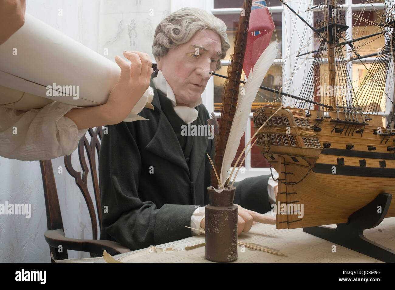 Model of Henry Adams, his assistant and a wooden warship in museum at Buckler's Hard Stock Photo