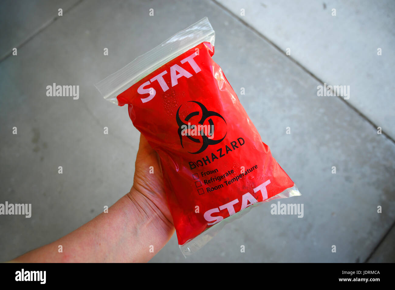 Disposable biohazard bag containing ice and refrigerated medication Stock Photo