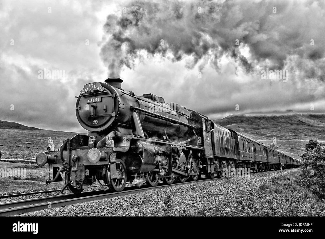 The Dalesman steam on the Settle to Carlisle railway seen here with the heavy LMS Class 8f passing through  Aisgill in the Yorkshire Dales Stock Photo