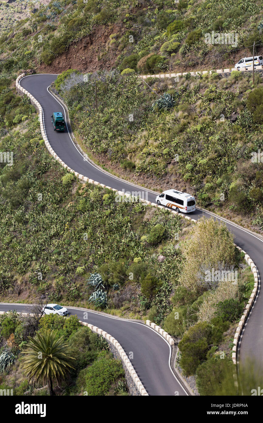 Traffic, minibuses, cars, coaches on the narrow mountain road from Santiago del Teide to Masca in Tenerife, Canary Islands, Spain Stock Photo